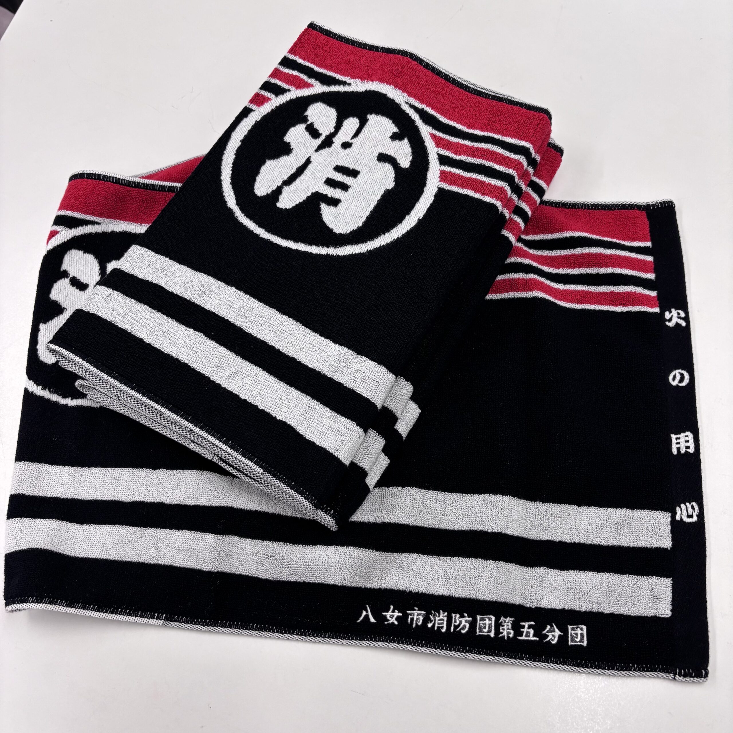 福岡県 八女市消防団第五分団様より消防団法被デザインフェイスタオルに刺繍加工のご依頼をいただきました。