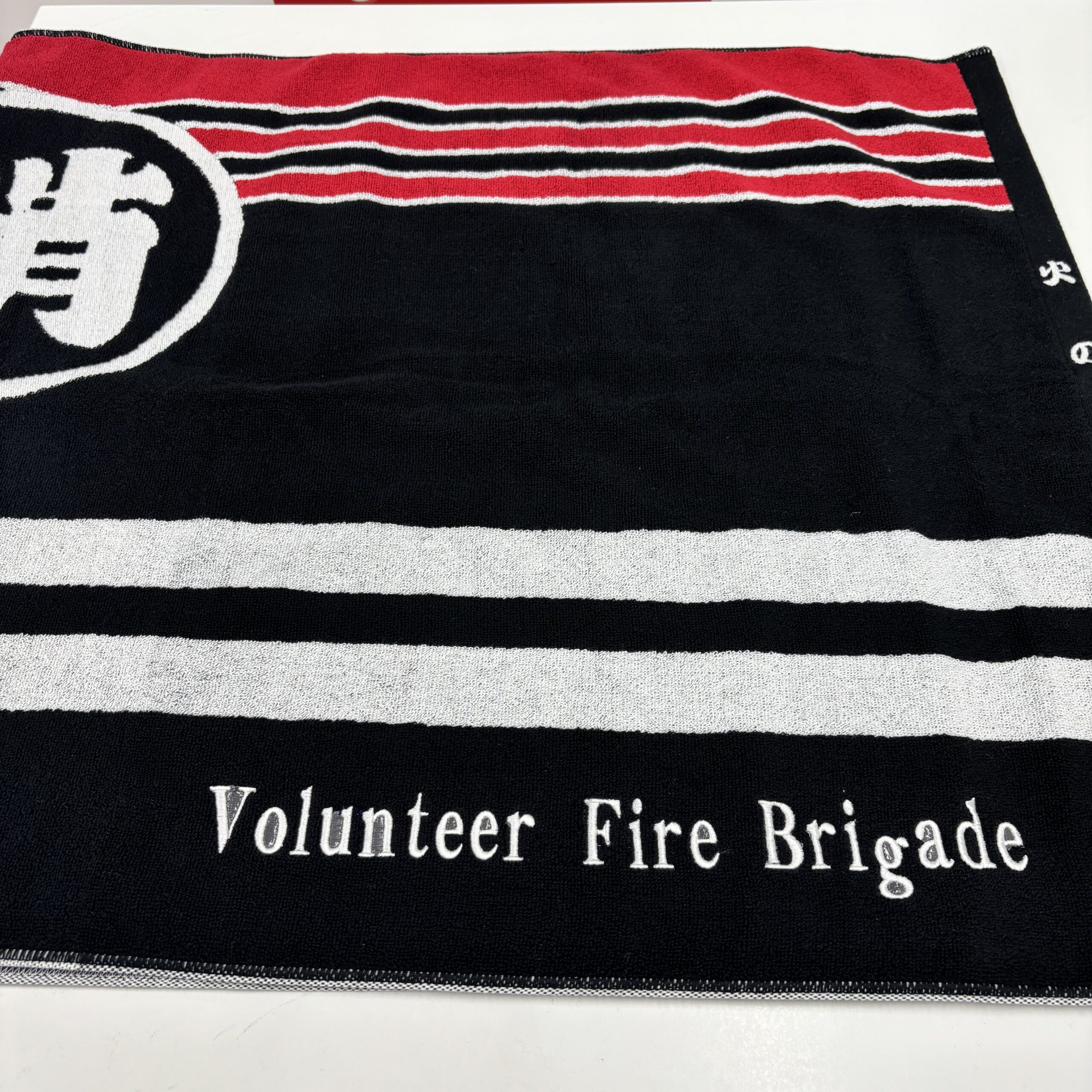 「消防団法被デザイン バスタオル」への刺繍加工（Volunteer Fire Brigade）のご依頼をいただきました。